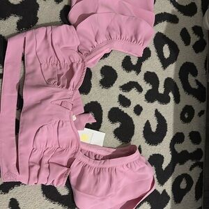 Crop top light pink shirt—new! Size large. The back has a clip and two straps.